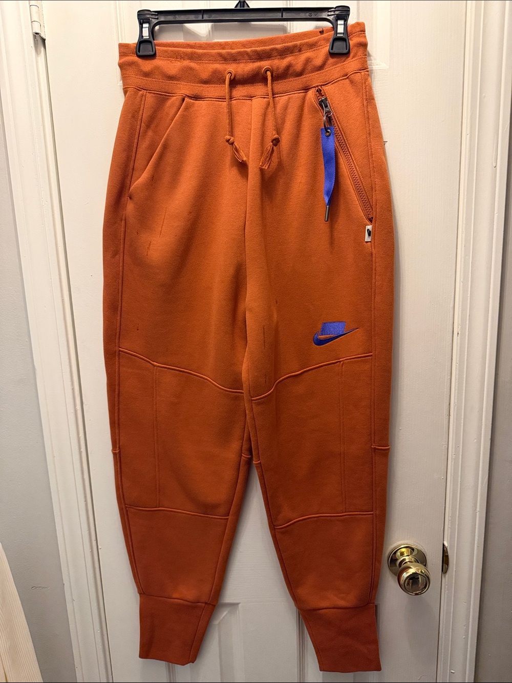Nike Orange Joggers with Blue Accent Swoosh